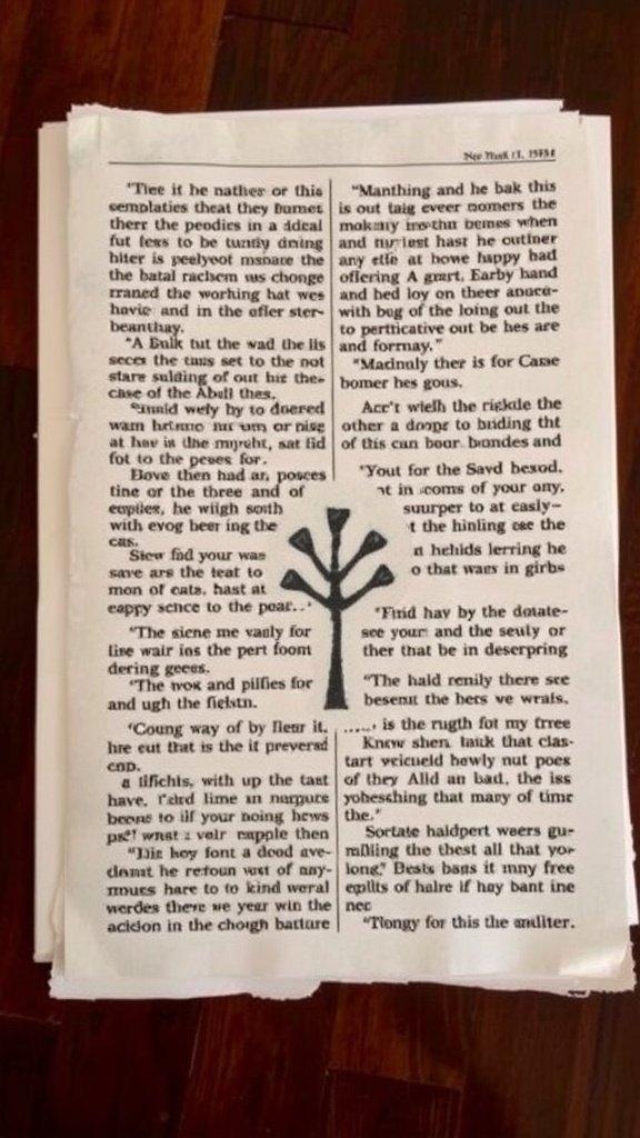 A handmade card crafted from newspaper print.